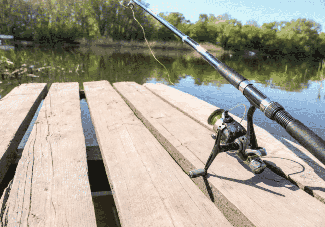 fishing rod and reel on pier