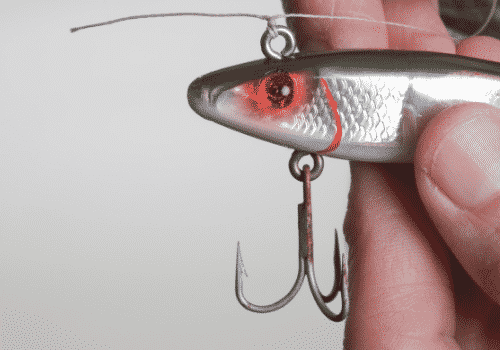 hand holing a fishing lure